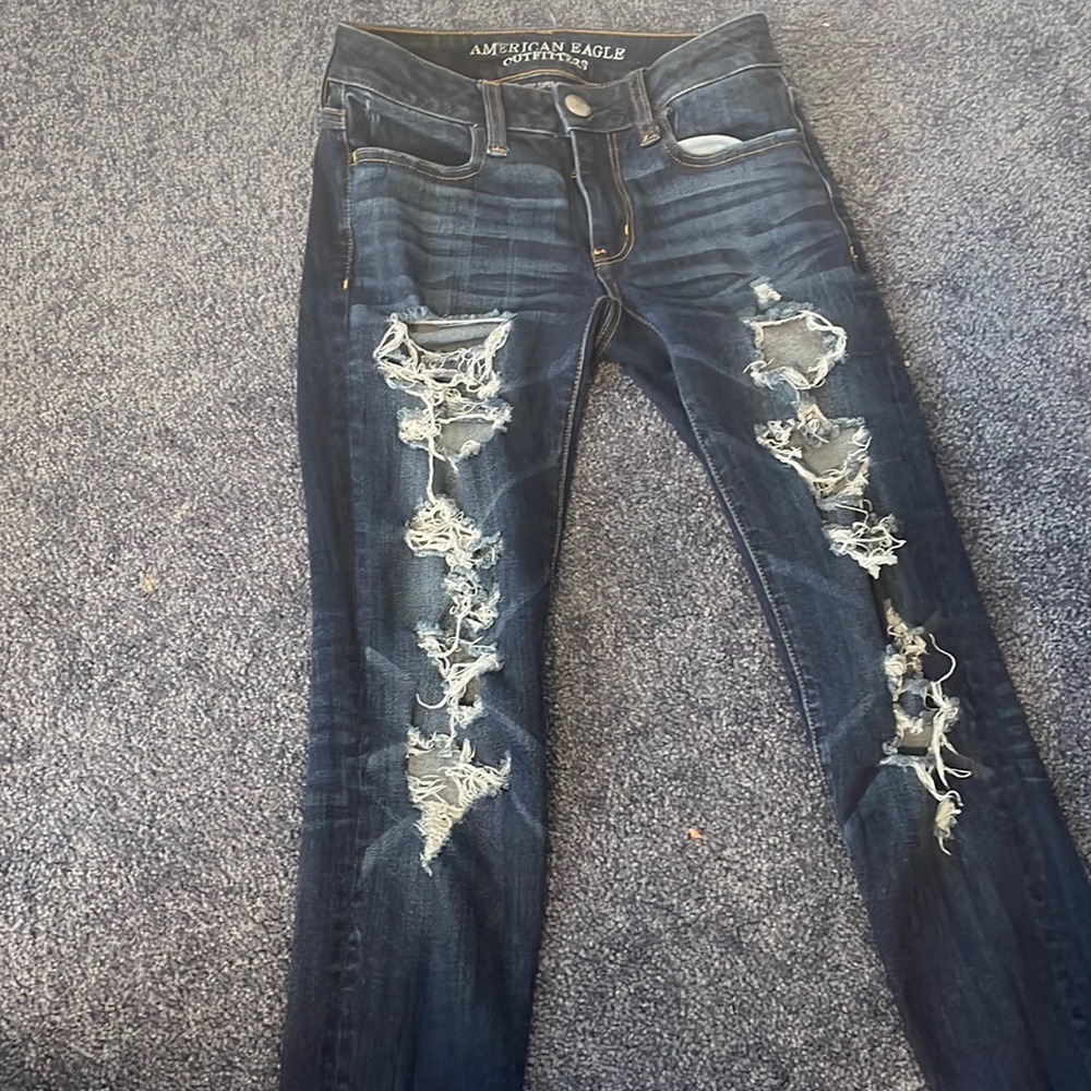 Y2K style low rise ripped American Eagle Denim jeans.